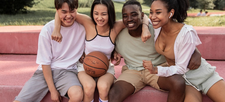 Four friends laughing together