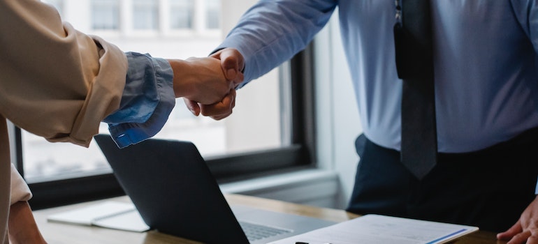 A man and a woman shaking hands