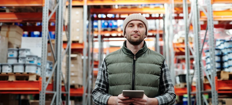 Man standing in warehouse.