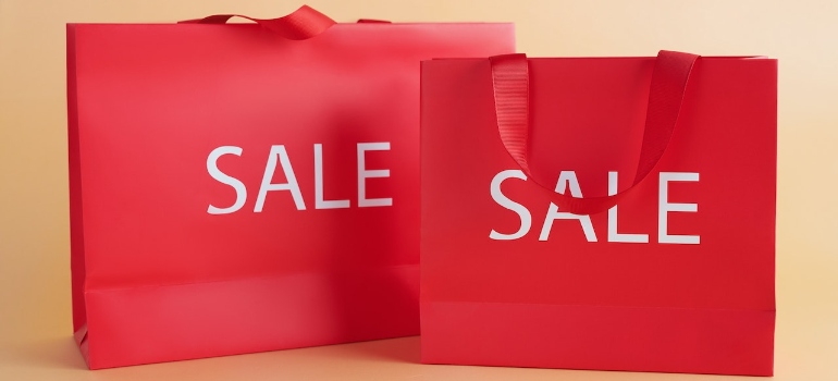 Red Gift Bags With Sale Sign