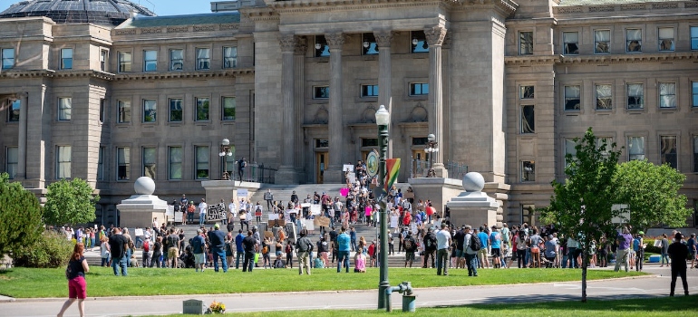 Crowd standing outside Idaho State Capitol palace