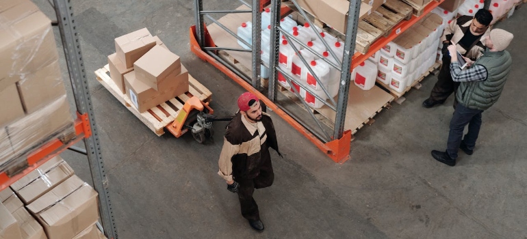 Men working in a warehouse under crisis management in logistics