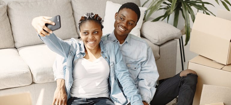 A Young a Couple Taking a Selfie in a Living Room