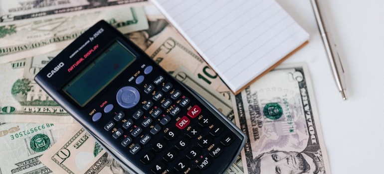 A calculator and a notebook you need to calculate expenses when moving out