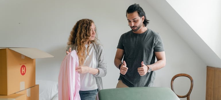 Thoughtful couple is packing belongings