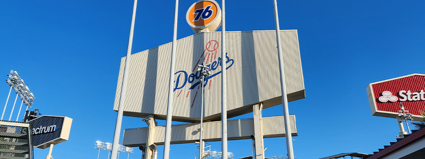 baseball stadium featuring a prominent sign that reads 