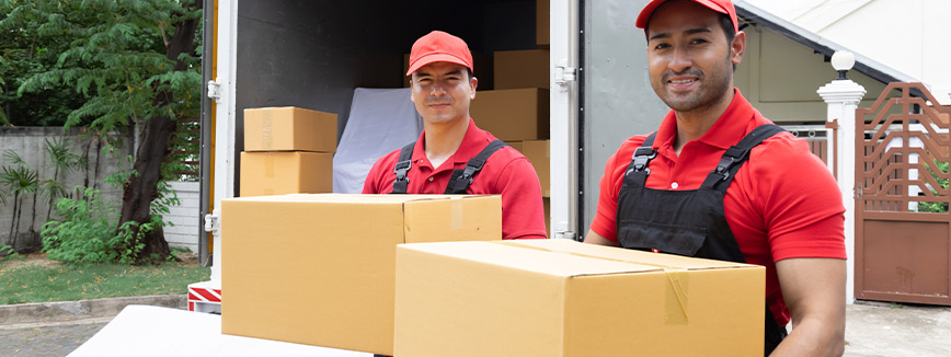 movers downloading boxes. Relocation, moving company.
