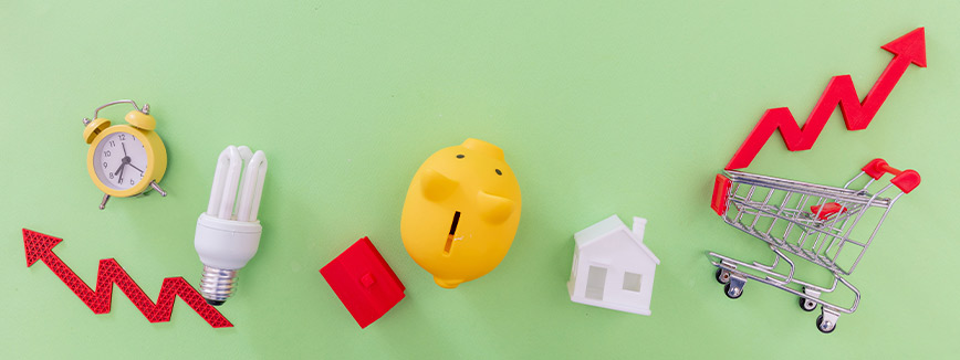 A collection of a yellow toy, red arrows, clock, light bulb, house, and shopping cart, symbolizing moving insights from Boise to Seattle.