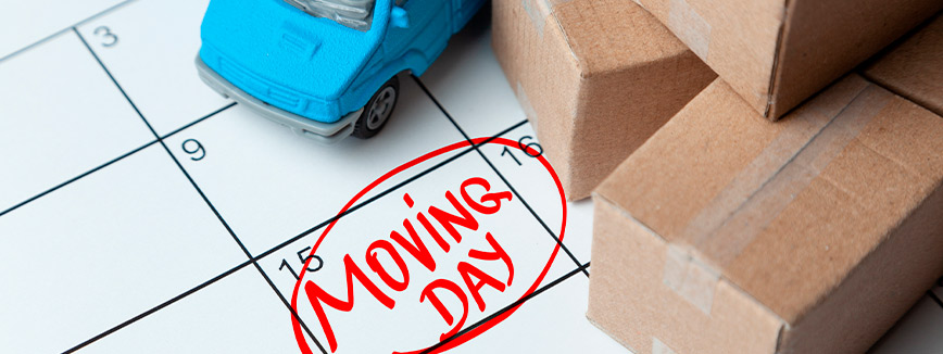 Moving day calendar with boxes and a small car as a reference.