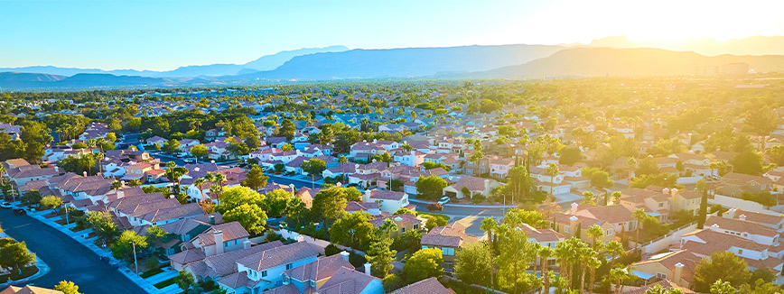 A residential neighborhood in Las Vegas, showcasing homes and streets, highlighting the appeal of moving from Idaho to Nevada.