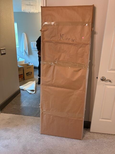 Person packing a box for storage