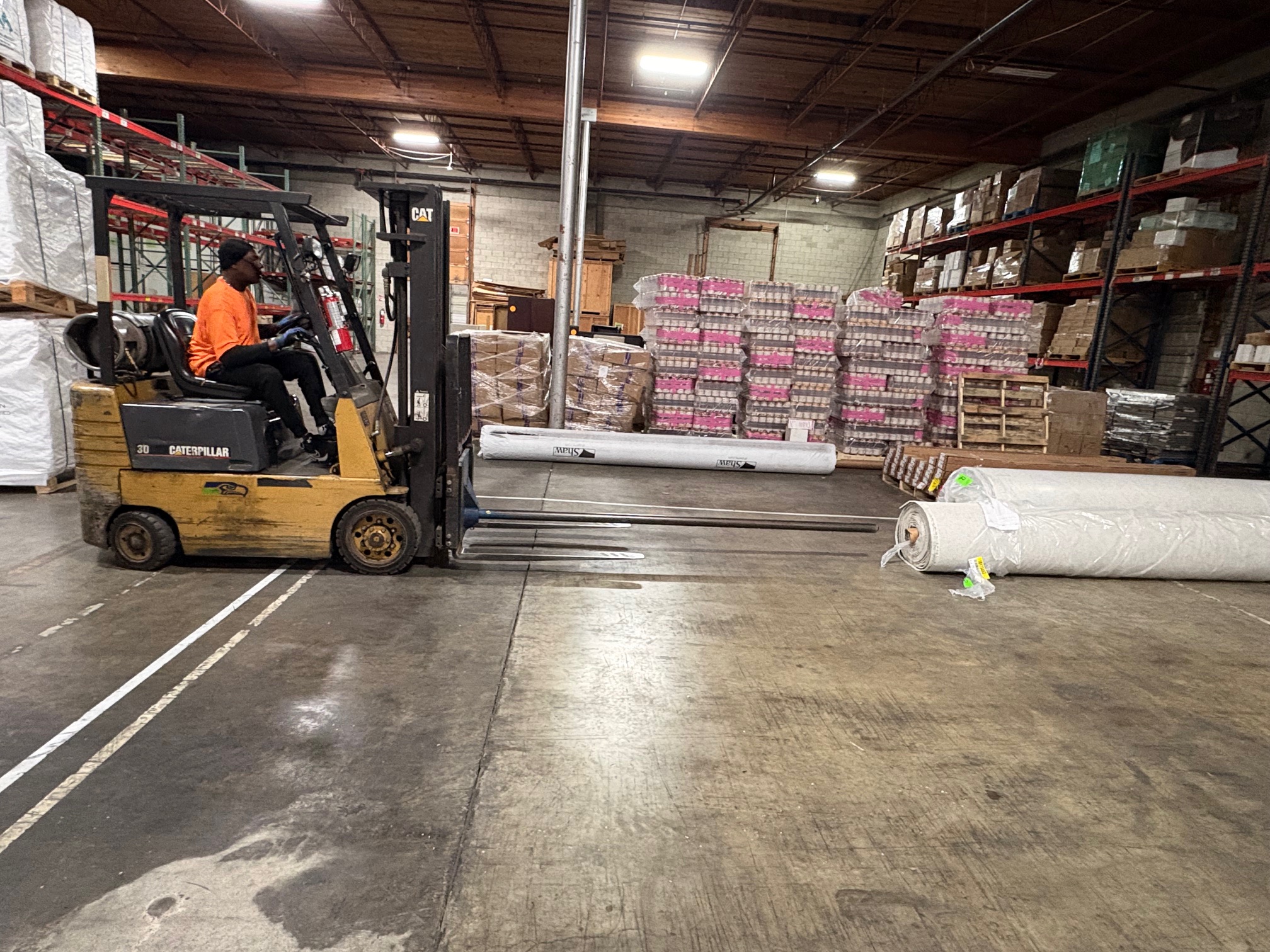 Man packing a box after hiring commercial equipment movers